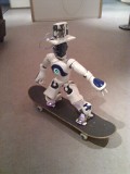 Nao on a skateboard during a sliding experiment.
